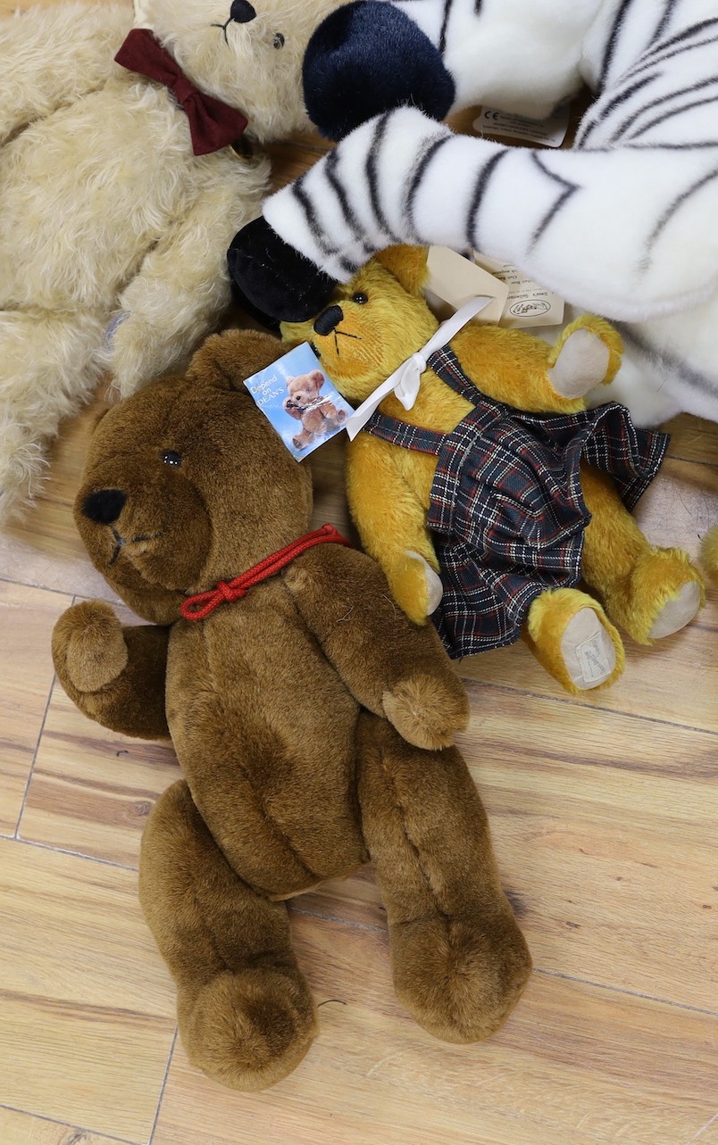 A Deans limited edition teddy Bear, boxed with three other Deans Bears and a large Merrythought Zebra